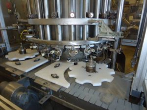 PFAUDLER 21 PISTON ROTARY FILLER, WITH CONVEYOR