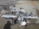 UNIVERSAL FRONT & BACK PRESSURE SENSITIVE LABELING MACHINE
