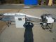 AIR-DRAULIC INCLINED CLEATED BELT CONVEYOR WITH AUTOMATIC DUMP, STAINLESS STEEL