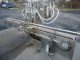 NATIONAL INSTRUMENT "FILAMATIC"" FOUR PISTON FILLER WITH CONVEYOR, 32 oz. pistons