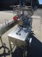 INLINE FILLING SYSTEMS SIX HEAD LEVEL HEAD OVERFLOW PRESSURE FILLER WITH 20 FT. CONVEYOR