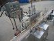JG MACHINE WORKS TWELVE SPOUT AUTOMATIC PRESSURE GRAVITY FILLER