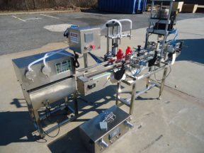 OCEAN PACKING TWO HEAD PUMP STYLE STAINLESS STEEL FILLING AND CAPPING MACHINE