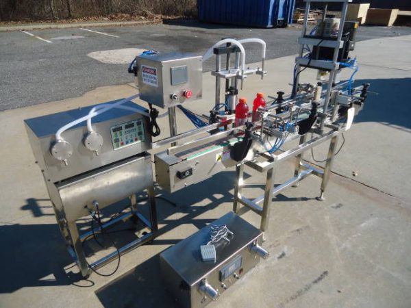 OCEAN PACKING TWO HEAD PUMP STYLE STAINLESS STEEL FILLING AND CAPPING MACHINE