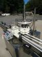 MRM Versafil Twelve Spout Rotary Positive Displacement Filler With Conveyor