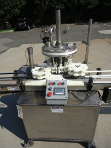 MRM Versafil Twelve Spout Rotary Positive Displacement Filler With Conveyor