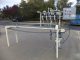 PVC 4 SPOUT STRAIGHT LINE AUTOMATIC PRESSURE GRAVITY LIQUID FILLING MACHINE