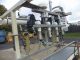 PVC 4 SPOUT STRAIGHT LINE AUTOMATIC PRESSURE GRAVITY LIQUID FILLING MACHINE