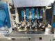 Pack West eight spindle inline automatic capper