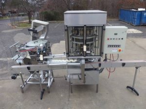 New England Machinery Ten Head Rotary Capper With  Feeder/Unscrambler