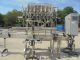 Fluid Packaging Solutions 10 Spout SS Gravity Liquid Filler, "Bottom Up" Fill