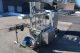 MRM/Elgin 8-Head Straightline Overflow Filling Machine