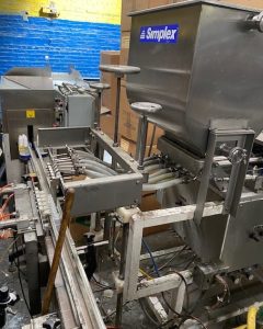 Simplex Six Head Piston Filler, with Conveyor