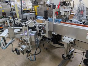Quadrel Automatic Wraparound Labeler, Tall Containers Quadrel Automatic Wraparound Labeler, Tall Containers